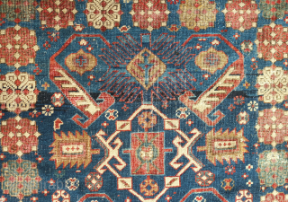 Shirvan rug, 19th century.  Talish guls surrounding the field.  Wonderful abstracted eagle and dragon or phoenix and phoenix motifs in the field surrounded by multiple floral borders.  Obvious wear  ...