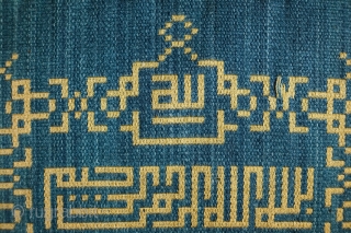 Damascene Silk Sura Panel, Early 20th Century.  It is the Surat el Ikhlass (Loyalty) and reads: 

Kul huwa allahu ahad
Allahu el samad
Lam yalid wa lam yulad
Wa lam yakun lahu kufuwan ahad

Translation:

Say  ...