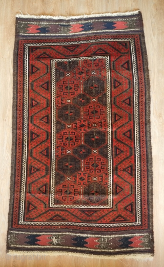 Baluch rug from the fourth quarter of the 19th century.  The wool is excellent quality and soft.  The design is in a repeat hooked octagon motif in rich reds and  ...