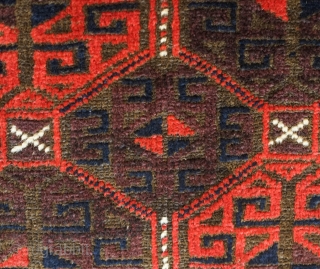 Baluch rug from the fourth quarter of the 19th century.  The wool is excellent quality and soft.  The design is in a repeat hooked octagon motif in rich reds and  ...