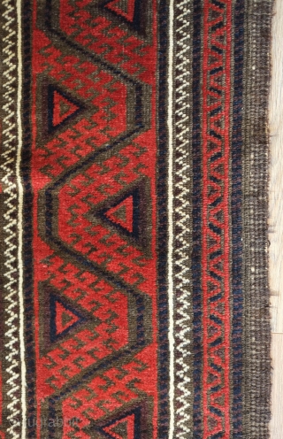 Baluch rug from the fourth quarter of the 19th century.  The wool is excellent quality and soft.  The design is in a repeat hooked octagon motif in rich reds and  ...