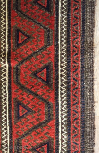 Baluch rug from the fourth quarter of the 19th century.  The wool is excellent quality and soft.  The design is in a repeat hooked octagon motif in rich reds and  ...