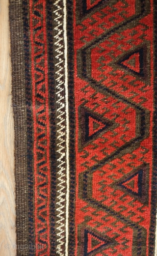 Baluch rug from the fourth quarter of the 19th century.  The wool is excellent quality and soft.  The design is in a repeat hooked octagon motif in rich reds and  ...