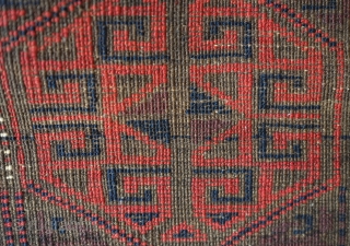 Baluch rug from the fourth quarter of the 19th century.  The wool is excellent quality and soft.  The design is in a repeat hooked octagon motif in rich reds and  ...