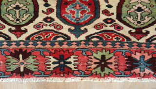 Bakhtyari rug.  White field and wonderful sense of movement.  It has a vivid color scheme. The crab border nicely frames the field. 127 x 200 cm     
