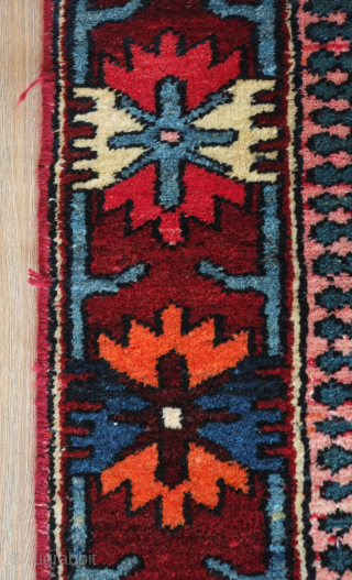 Bakhtyari rug.  White field and wonderful sense of movement.  It has a vivid color scheme. The crab border nicely frames the field. 127 x 200 cm     