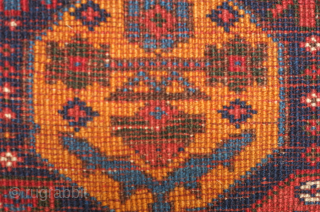 Afshar bag face, 19th century. Beautiful rich saturated colors including a deep green, a salmon red, a deep indigo blue, and mustardish yellow forming large, confident botehs.  There is a small  ...