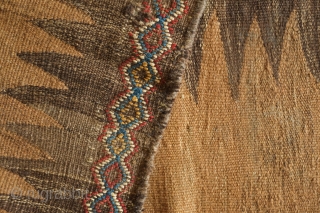 Kordi Runner Kilim, 1900 or so.  Finger-like serrations along the inner field with a stiking extra-weft pendant in the center in natural dyes.  The border is also in extra-weft wrapping  ...