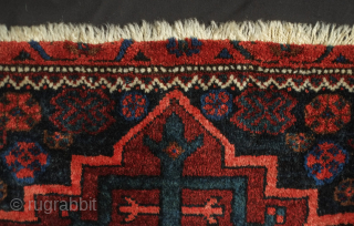 Afshar-Baluch pile bag face, 19th century.  The wool is plush and soft.  The central star is in a geometrical architectural configuration inside a lobed medallion that appears to float on  ...