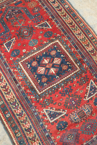 Kazak prayer rug dated to 1907(1322). Some wonderful archaic graphic elements on a deep red ground. It has a couple of very small areas of re-piling and a small section on the  ...
