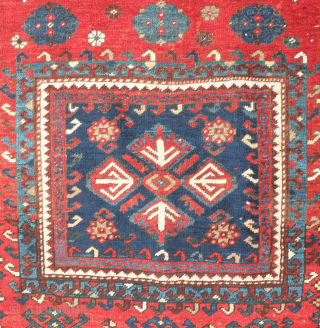 Kazak prayer rug dated to 1907(1322). Some wonderful archaic graphic elements on a deep red ground. It has a couple of very small areas of re-piling and a small section on the  ...