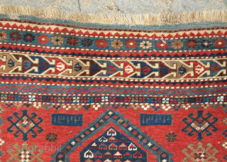 Kazak prayer rug dated to 1907(1322). Some wonderful archaic graphic elements on a deep red ground. It has a couple of very small areas of re-piling and a small section on the  ...
