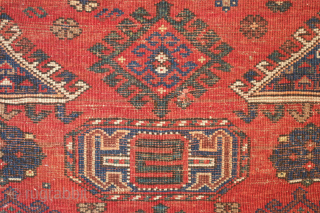 Kazak prayer rug dated to 1907(1322). Some wonderful archaic graphic elements on a deep red ground. It has a couple of very small areas of re-piling and a small section on the  ...