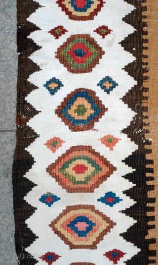 South Azerbaijan Kilim, Late 19th Century. Camel wool field surrounded by white border with striking colorful medallions. Excellent colors. It has a couple of stains, one on the upper medallion and another  ...