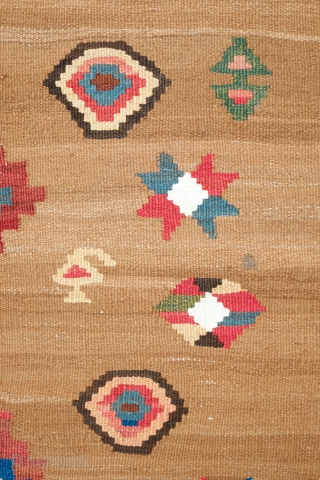South Azerbaijan Kilim, Late 19th Century. Camel wool field surrounded by white border with striking colorful medallions. Excellent colors. It has a couple of stains, one on the upper medallion and another  ...