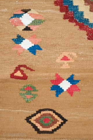 South Azerbaijan Kilim, Late 19th Century. Camel wool field surrounded by white border with striking colorful medallions. Excellent colors. It has a couple of stains, one on the upper medallion and another  ...