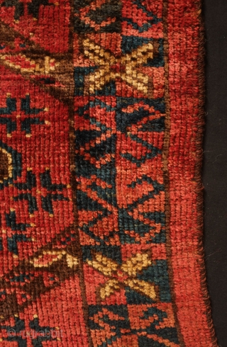 Beshir torba face, 19th century.  Striking large, centrally placed floral motif.  A small area secured along the bottom left selvage.  A solid piece.  43 x 126 cm  