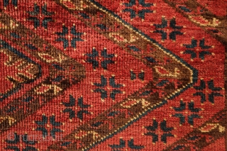 Beshir torba face, 19th century.  Striking large, centrally placed floral motif.  A small area secured along the bottom left selvage.  A solid piece.  43 x 126 cm  