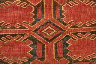Beshir torba face, 19th century.  Striking large, centrally placed floral motif.  A small area secured along the bottom left selvage.  A solid piece.  43 x 126 cm  