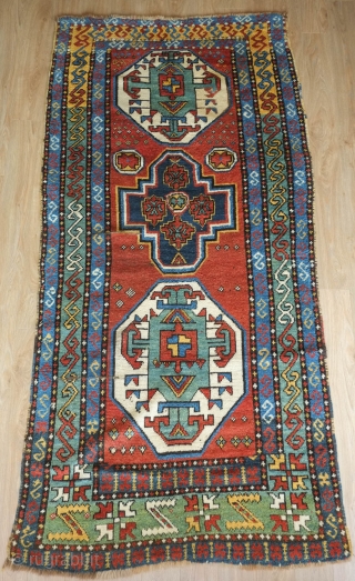 Kazak rug, 19th century.  This is a village woven Kazak rug quite distinct from the commercial production of the area of the time. It has a free style of drawing and  ...