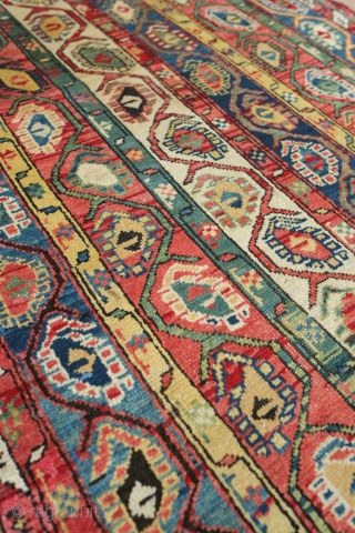 Genje Shawl Design Rug, 4th quarter of the 19th century.  Wonderful array of colors, counting around seven.  The Kashmir boteh shawl design is elegantly articulated in wider stripes than usual.  ...