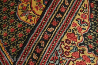 Senneh Kilim, 2nd quarter of the 20th century.  Great natural colors.  Field full of pink and green flowers.  A rich, striking kilim.  140 x 207 cm.   