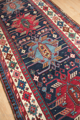 Talish long rug, 19th century.  Fantastic colors. Eagle medallions on a deep indigo ground.  Striking border in a colorful array of stepped medallions. Contains around nine colors.  A few  ...