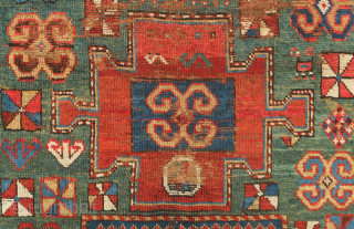 Fachralo green ground rug, 19th century. Wonderful field of green, kochanak border and elibelinde motifs on both ends of the field. Obvious wear but all there. 142 x 234 cm   
