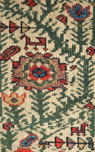 Malayer Rug, 3rd quarter of 19th century.  Abrash and lines bisecting the field.  The red in the elegantly articulated border flowers is not chemical and is madder dyed using a  ...