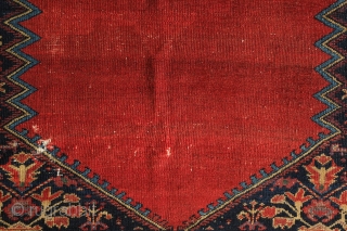 Malayer Rug, 3rd quarter of 19th century.  Abrash and lines bisecting the field.  The red in the elegantly articulated border flowers is not chemical and is madder dyed using a  ...