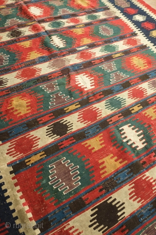 Kazak Kilim, 3rd Quarter of the 19th century.  Exceptional rich and saturated colors and paper-like weave.  It has a number of small repairs and some white warp flecks show in  ...