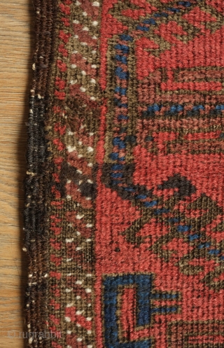 Timuri Baluch Rug, 3rd to 4th Quarter of the 19th Century. The design is in a repeat kalamdani (pen case) or centipede design. The border is an abstracted Yomut boat border originally  ...