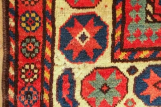 Fachralo Kazak rug, 19th century.  Excellent pile and colors including a very deep saturated purple.  Wonderful small florette outer border and eight-pointed start main border.  Two small spots of  ...