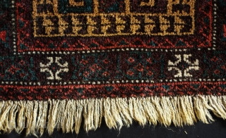 Baluch Balisht.  Sistan or Adraskand. Late 19th/early 20th century.  Tree of life motif with alternating colors in the hooks giving the piece a dynamic motion. Deep purple throughout and camel  ...