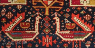 Akstafa long rug, 19th century.  Excellent colors generously applied.  The wool is extremely soft and velvet-like.  Two inward facing speckled camelids in the center.  I count around 9  ...