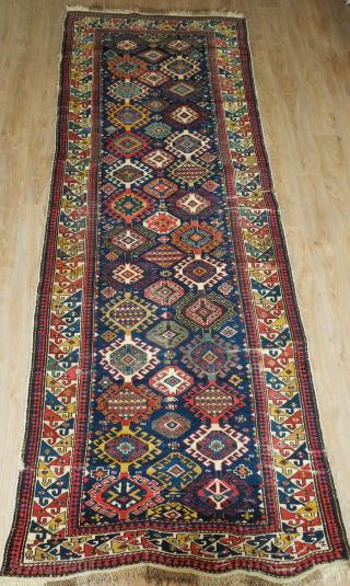 Shirvan Runner, 3rd to 4th Quarter of the 19th Century. Fantastic colors. Hooked medallion aligned in two columns. The rug has some worn spots and a section at the bottom that was  ...