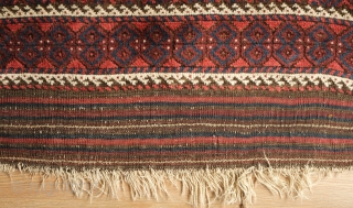 Khorassan Baluch rug, 4th quarter of the 19th century.  Saturated blues and rich brooding ember red.  Kilim ends in tact.  Linked hexagon border with "S" figures in the center  ...