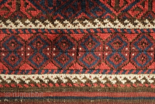 Khorassan Baluch rug, 4th quarter of the 19th century.  Saturated blues and rich brooding ember red.  Kilim ends in tact.  Linked hexagon border with "S" figures in the center  ...