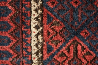 Khorassan Baluch rug, 4th quarter of the 19th century.  Saturated blues and rich brooding ember red.  Kilim ends in tact.  Linked hexagon border with "S" figures in the center  ...