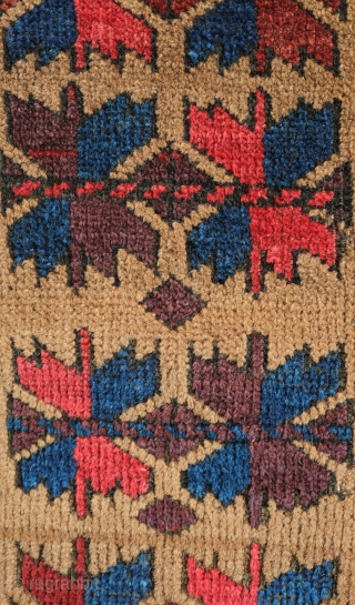 Khorasan Baluch rug, late 19th century.  Tree of life design over a camel wool ground.  Vivid purple in the leaves.  Some damage on one side of the selvedge.   ...