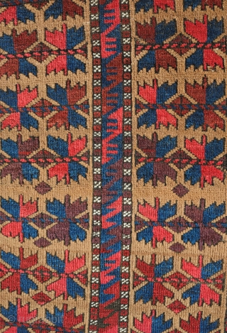 Khorasan Baluch rug, late 19th century.  Tree of life design over a camel wool ground.  Vivid purple in the leaves.  Some damage on one side of the selvedge.   ...