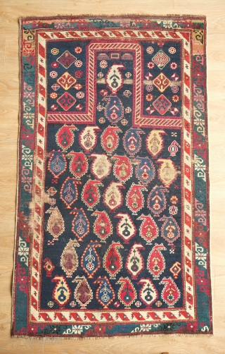 Shirvan Prayer Rug, 4th quarter of 19th Century.  Deep indigo blue ground and wonderful botehs in alternating directions.  The serrations around the botehs have the appearance of small "horns" on  ...