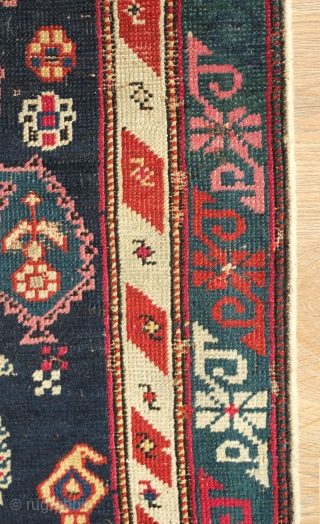 Shirvan Prayer Rug, 4th quarter of 19th Century.  Deep indigo blue ground and wonderful botehs in alternating directions.  The serrations around the botehs have the appearance of small "horns" on  ...