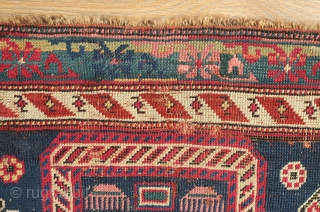 Shirvan Prayer Rug, 4th quarter of 19th Century.  Deep indigo blue ground and wonderful botehs in alternating directions.  The serrations around the botehs have the appearance of small "horns" on  ...