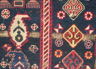 Shirvan Prayer Rug, 4th quarter of 19th Century.  Deep indigo blue ground and wonderful botehs in alternating directions.  The serrations around the botehs have the appearance of small "horns" on  ...