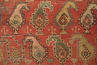 Genje or other Caucasus region rug, late 19th century.  The boteh are in juxtaposing directions in alternating rows.  The colors are beautiful green, pink and indigo.  Note the crosses  ...