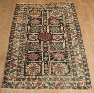 Kuba rug, 19th century. Wonderful floral star and blossom motifs between lattices.  Lower pile and some wear but all there and visible.  Crisp drawing.  Intriguing little motifs interspersed in  ...