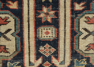 Kuba rug, 19th century. Wonderful floral star and blossom motifs between lattices.  Lower pile and some wear but all there and visible.  Crisp drawing.  Intriguing little motifs interspersed in  ...
