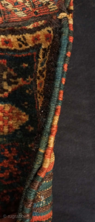 Qashqa'i Chanteh, 19th century.  Deep green-blue ground.  Vivid striped back.  Well executed soumak work on the top.  All good colors.  Selvedge missing and there is a small  ...