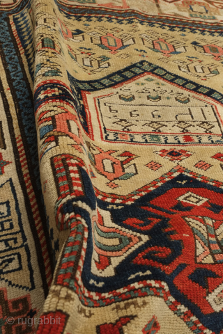 Kuba prayer rug, dated to 1884 according to the mixed Arabic and Western numbers in the inscribed date. Yellowish ground.  Kufic borders. Double headed birds and animals in the field.   ...